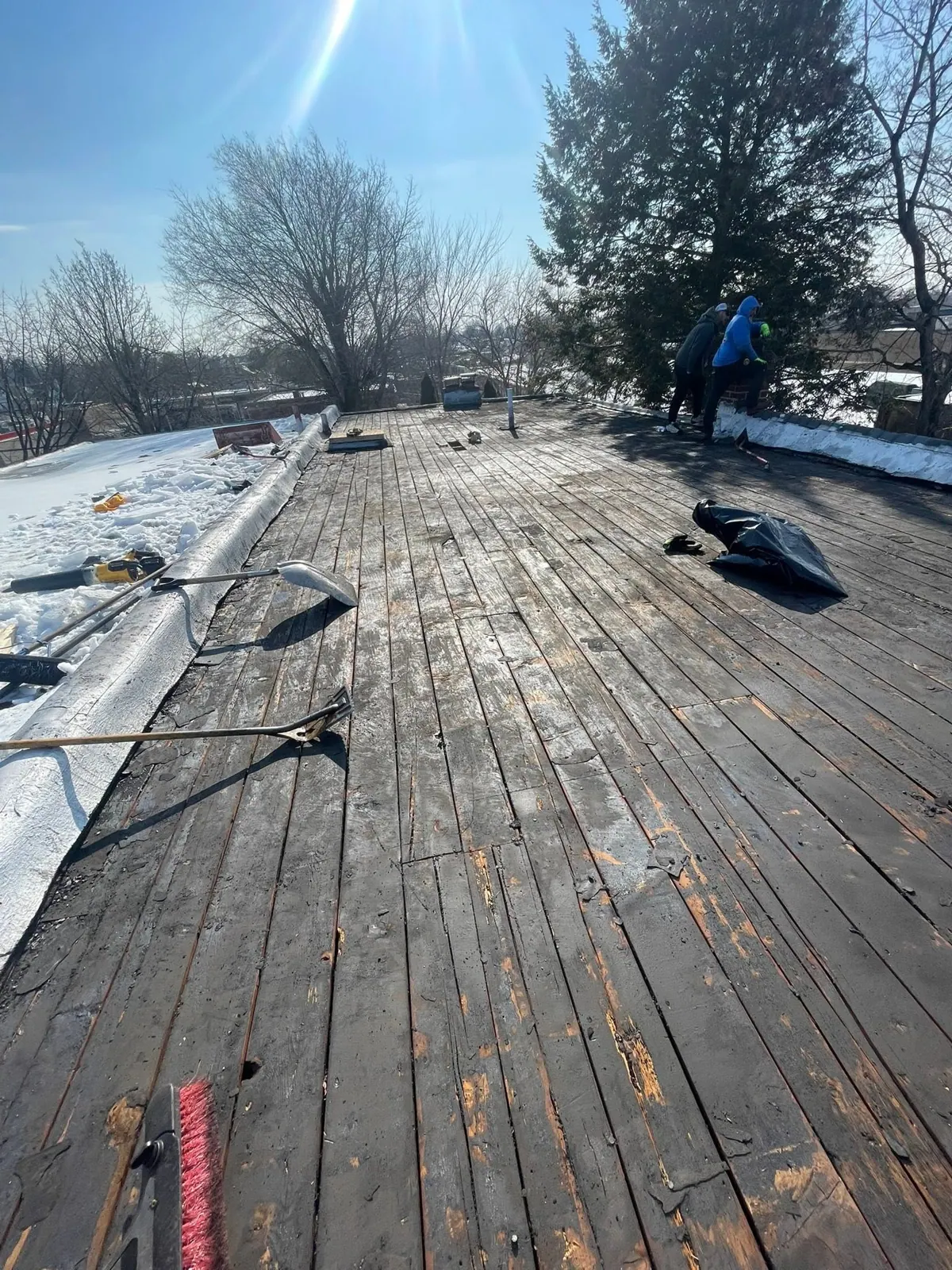 A flat roof opened down to the old deck boards during one of Joe's tear-offs